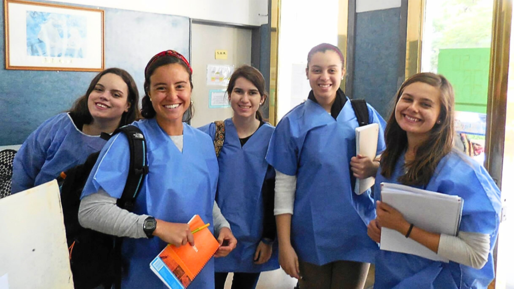 5 medical spanish students wearing blue scrubs at spanish immersion school
